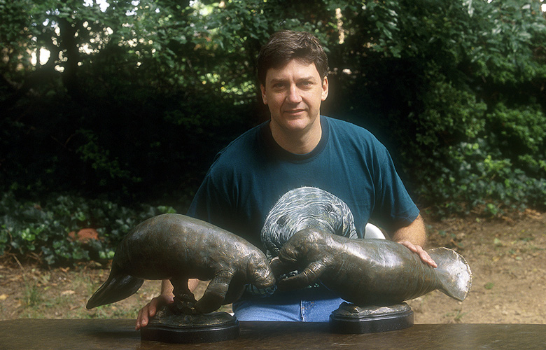 Shawn with Manatee Sculptures